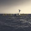 photo of a boy jumping into sea